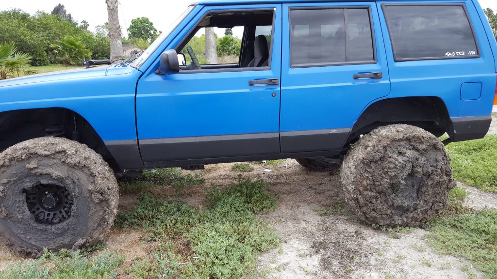 Fully mudded Jeep